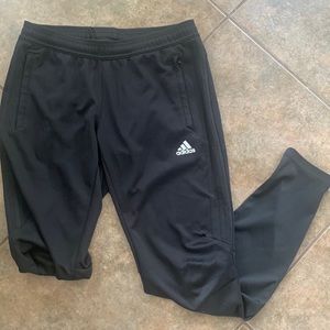 Woman’s Adidas joggers.